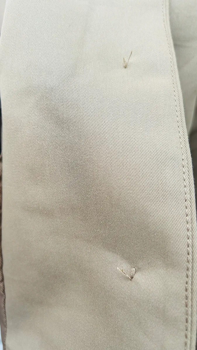 Refuerzo de botones en chaqueta